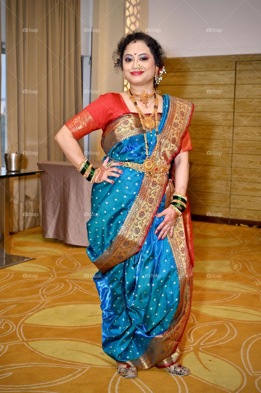 Traditional look. A blue saree draped in style called brahmni kashta.