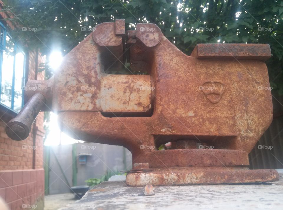 Old tool. Vice. Work outside in the yard.