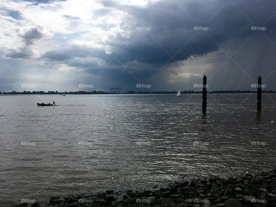 Scenic view of sea against cloudy sky