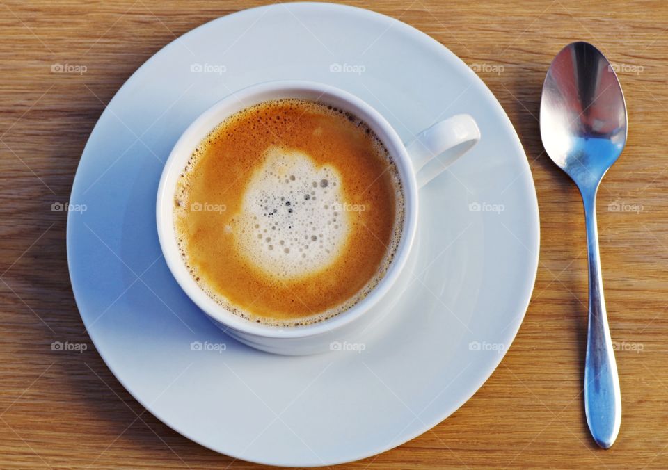 cup of coffee on wooden background