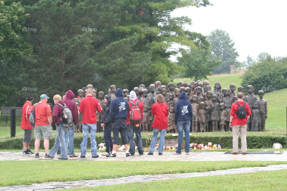 Dutch Scouts standing silent and pay respect in front of the Lidice childeren memorial. The Czech village Lidice was subject to the terror of WOII and completely demolished. All the men above 17 were shot to death on the scene and all women and children, except a few who were selected, send to different  (extermination) camps. Here are our Explorers (scouts) in front of 82 life size bronze statues. Made off the last photograph taken from them on the platform before they left by deportation.