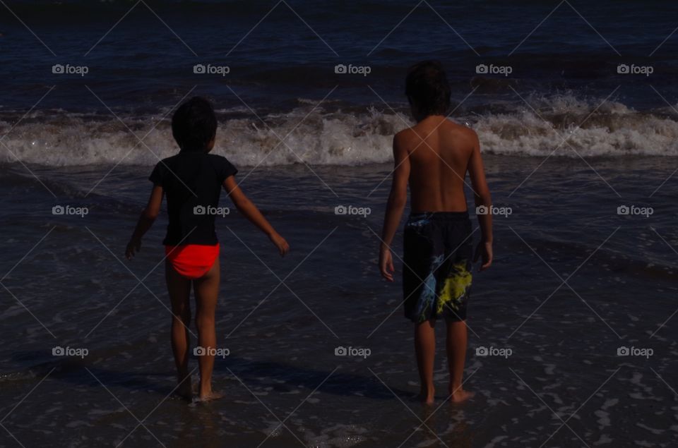 Children at water's edge