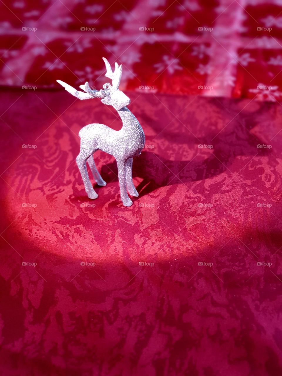 silver glittering deer on a magenta background