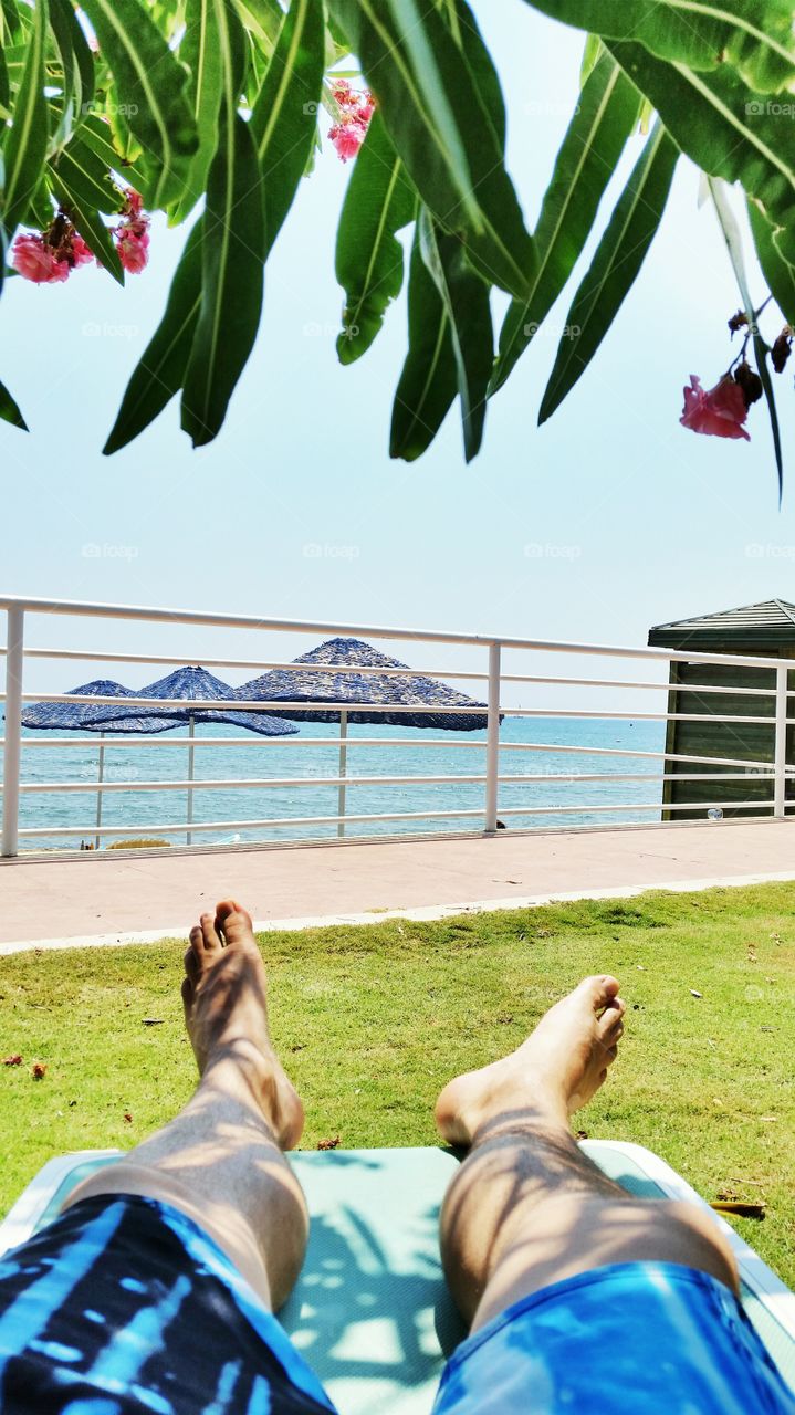 My feet on vacation. I am taking my vacation in Antalya, Turkey. It is a perfect serene day. Sun, beach, sea and some peace.