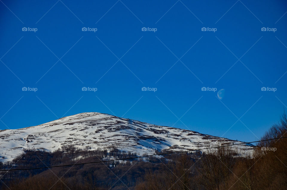 Moon on the background of mountains