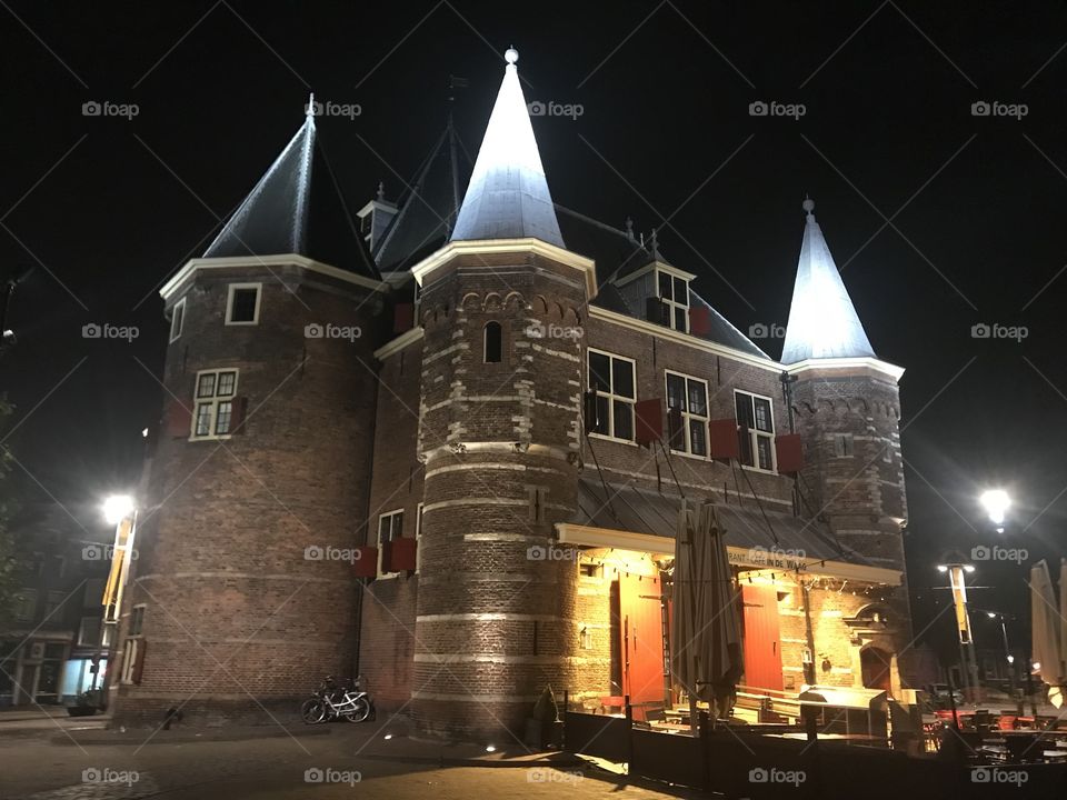 A photo at the center of Amsterdam at night.