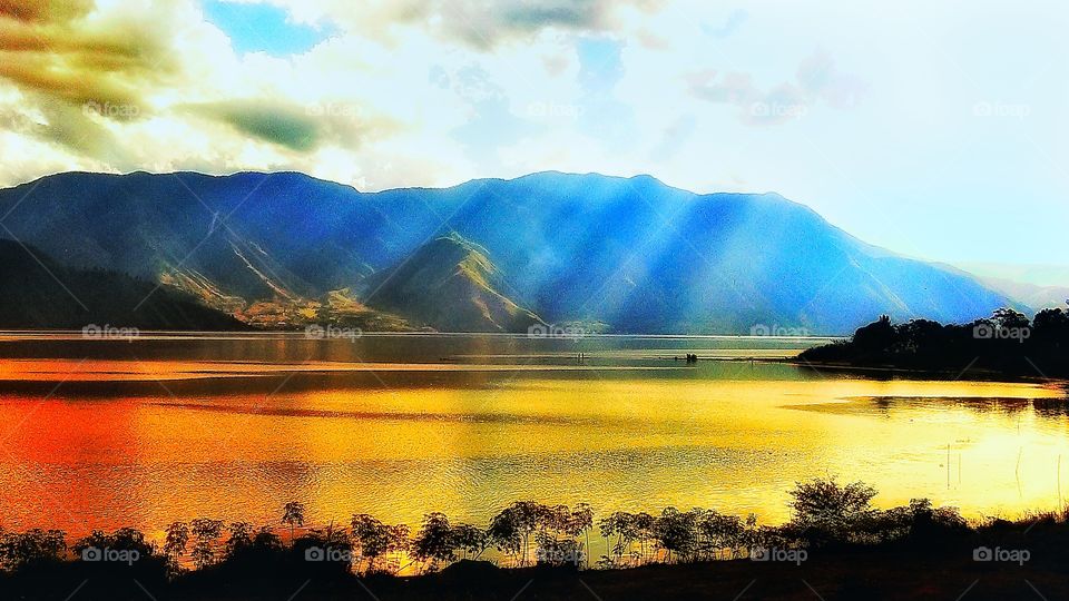 Sun is sting on the biggest crater lake - Sumatran Toba...