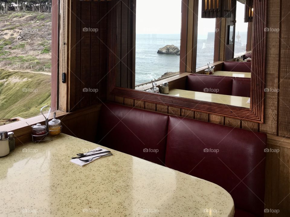 Window view of breakfast place by the ocean