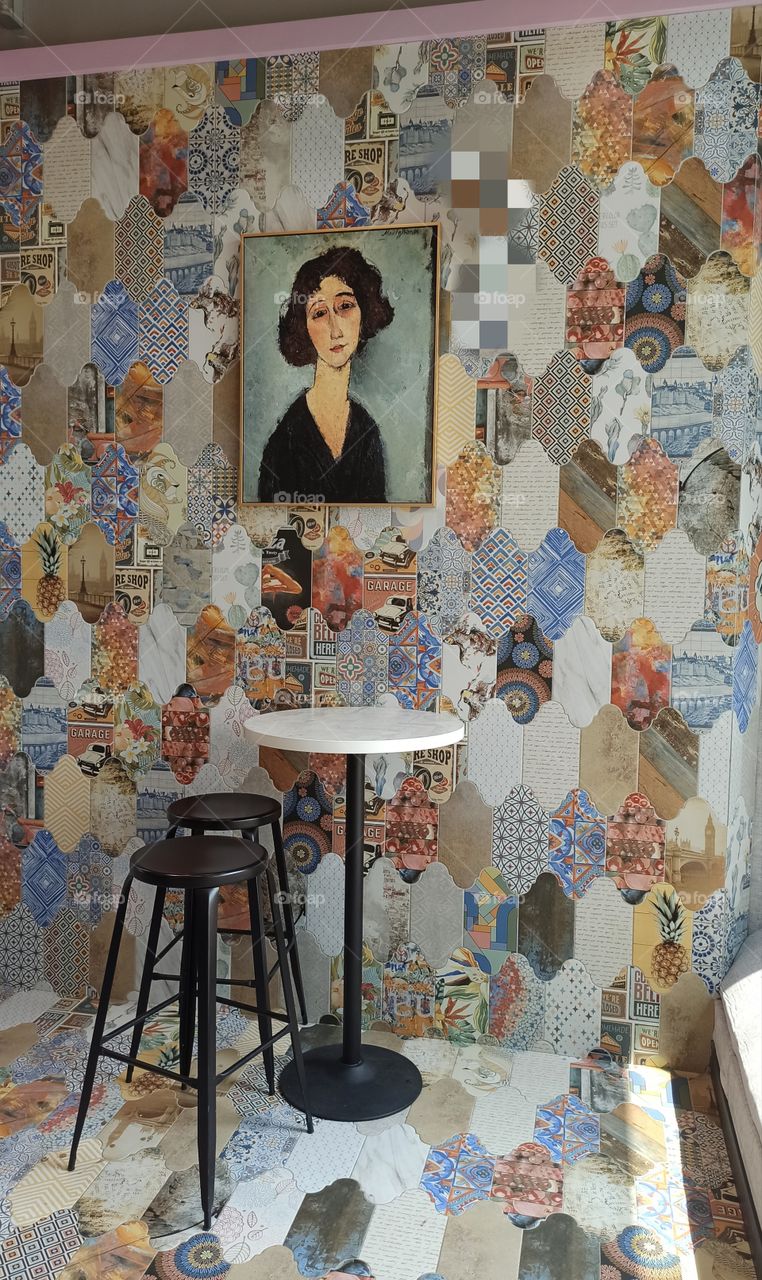 The portrait on the mosaic wall.