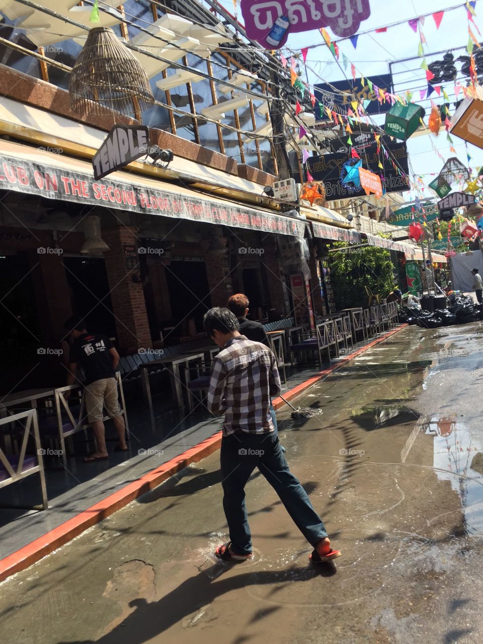 Cambodia Photos of Pub Street after The Cambodian New Year. Holy Water Throwing Holiday. CM Photography April 2019. @chelseamerkleyphotos on Foap.