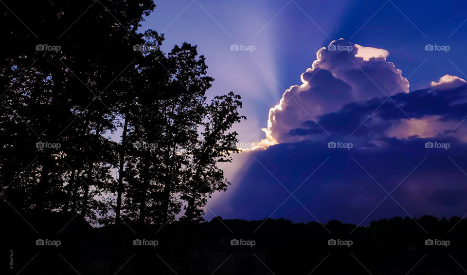 Evening sky ..sun behind the clouds... scattering reys