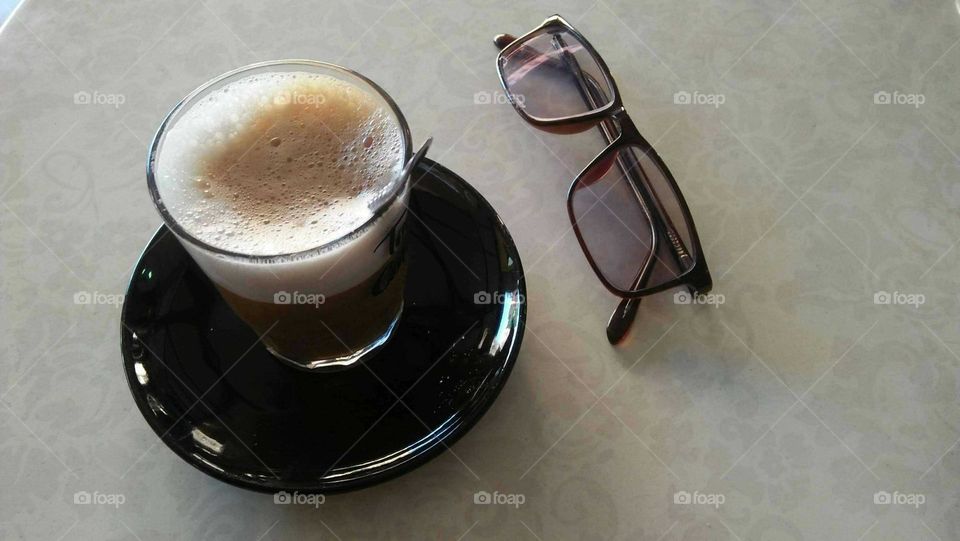 My favorite cup of coffe and my glasses.