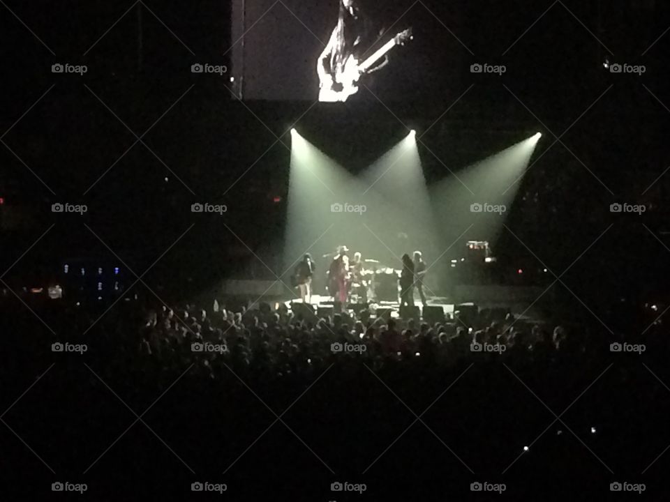 Rock and roll far away on stage at a concert 