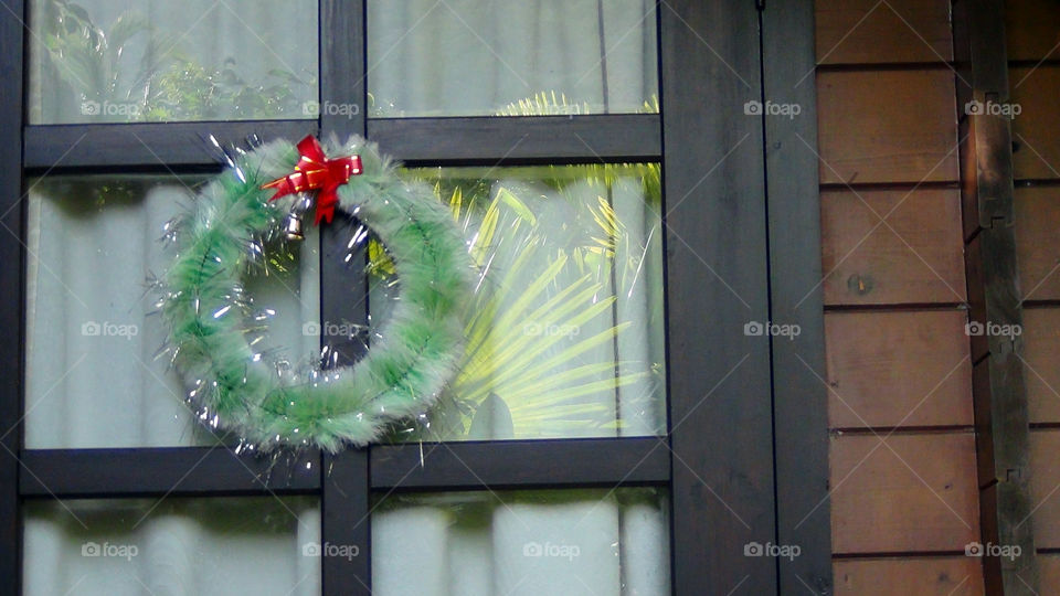 Christmas wreath on a door, a symbol of goodness , cheer, well being and love all around.