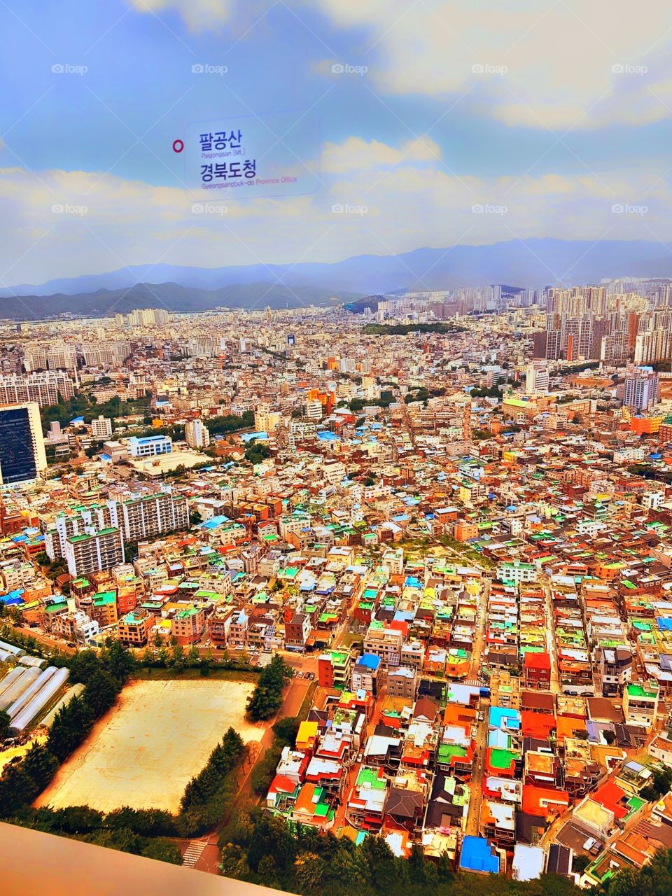 Her is the view of city.
lots of houses and buildings.
you can see the mountains too even its too much far.
the city are so lively because of their vibrant colors.
it is such a lovely day with a lovely place. πππ