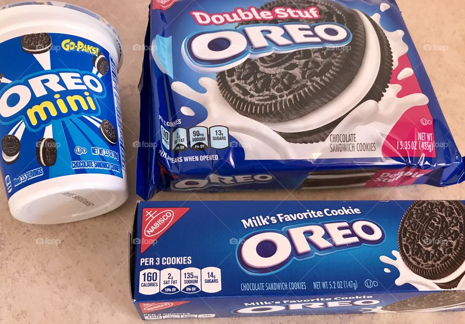 Mini and double stuf Oreo cookies flat lay in a counter top