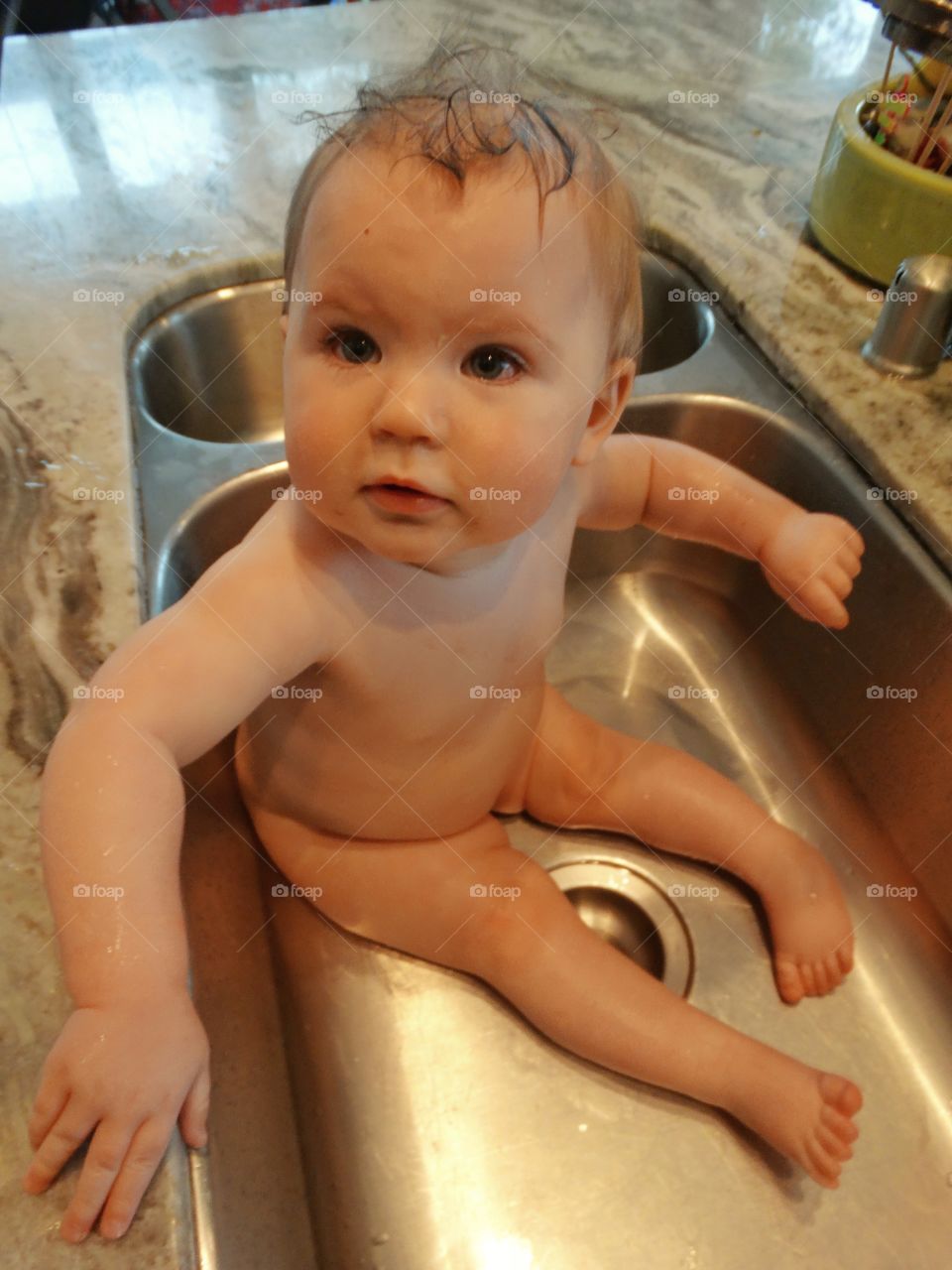 Baby Taking A Bath In The Kitchen Sink