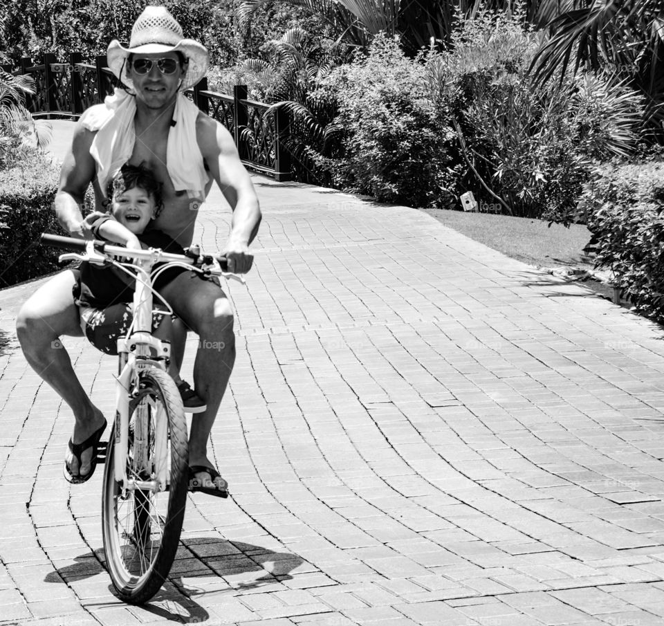 Father and son enjoying on bicycle