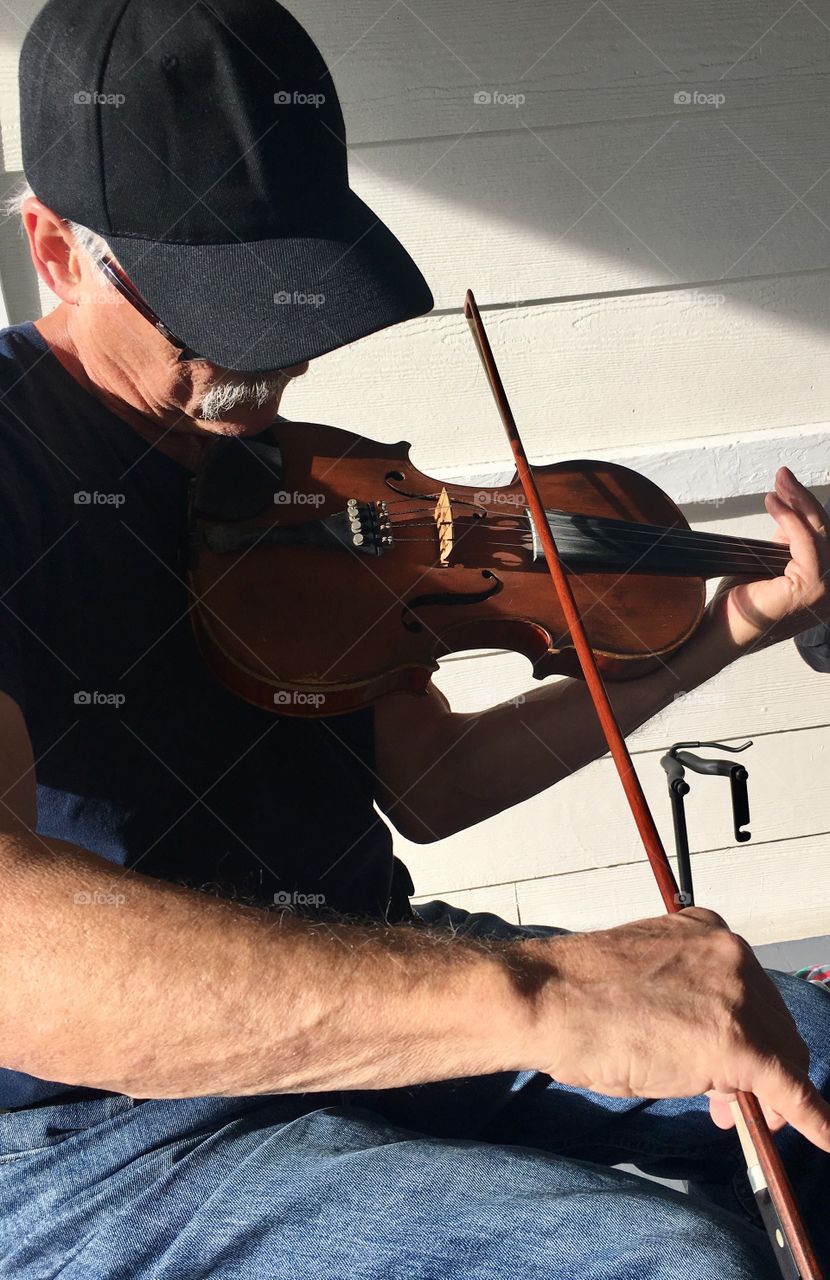 Fiddler Playing with Light