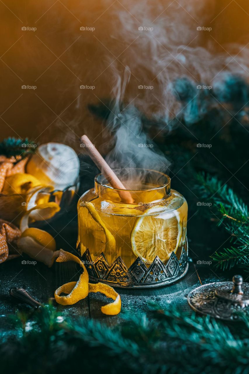 Steaming lemon decoction in a vintage glass jar is a treatment for colds, headaches, bad mood and fatigue. Mom's concern.