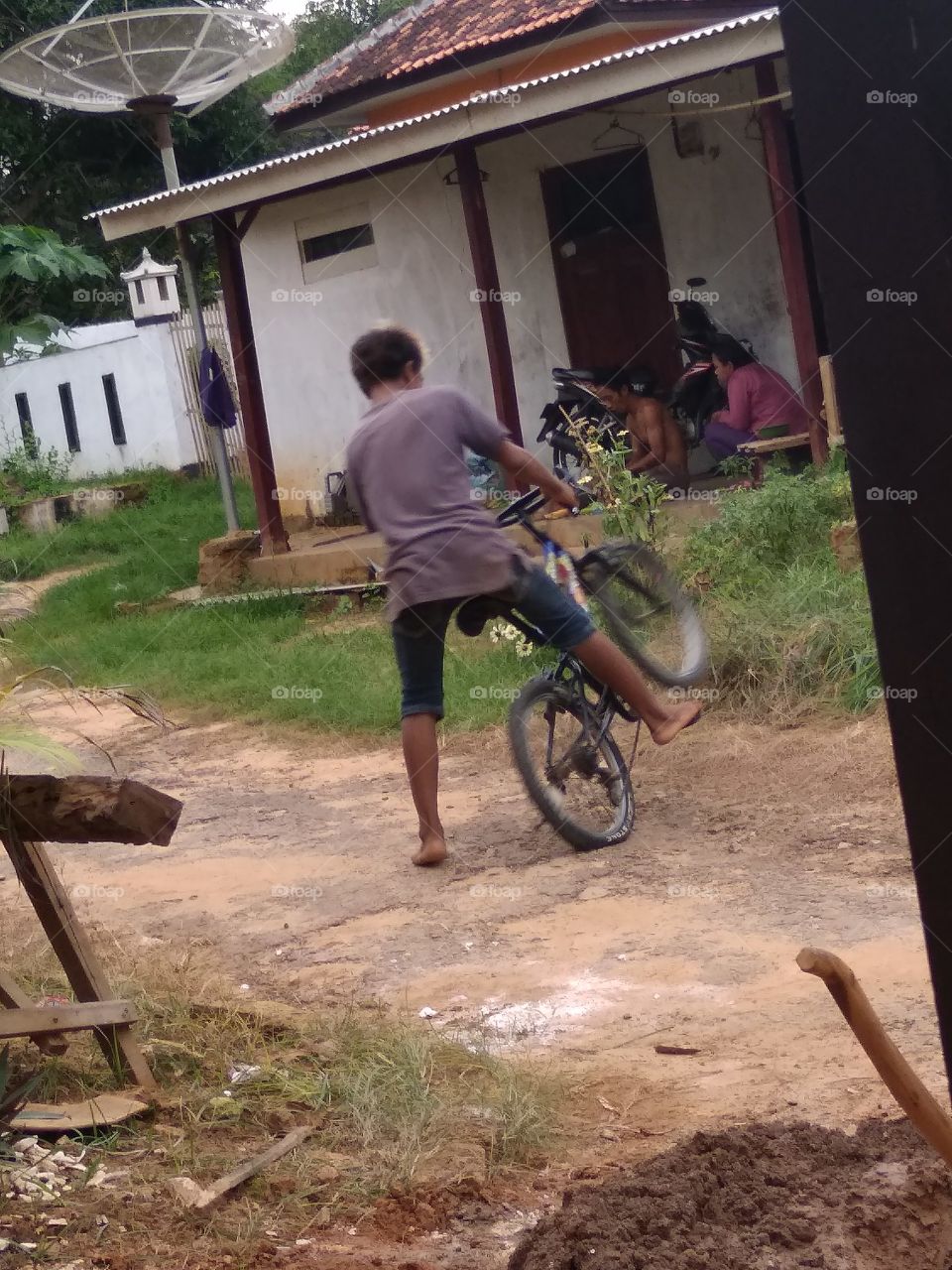 The village boy is happy to play happily