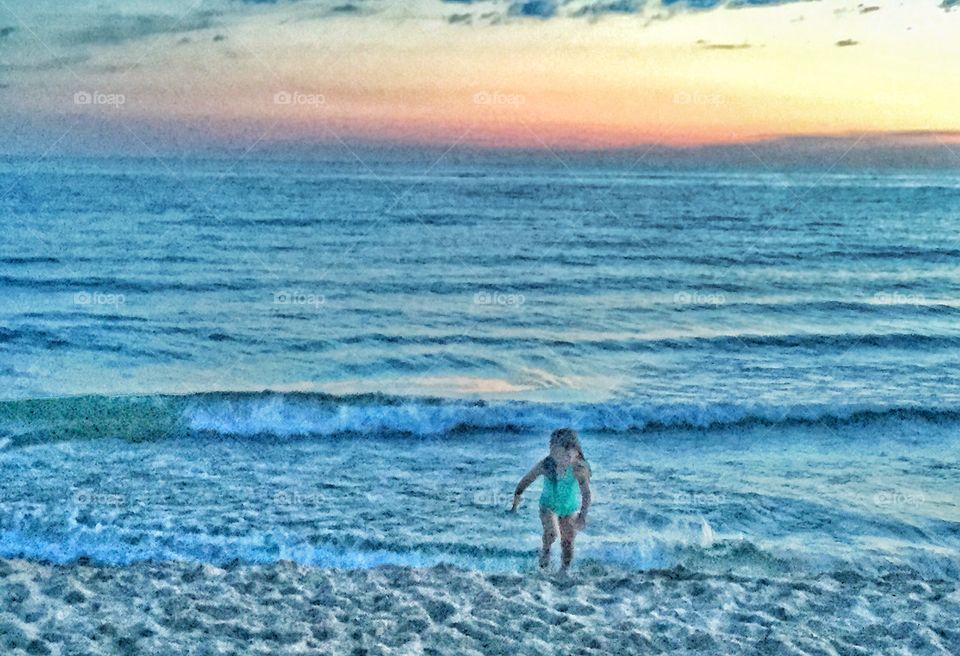 Playful sunset beach girl