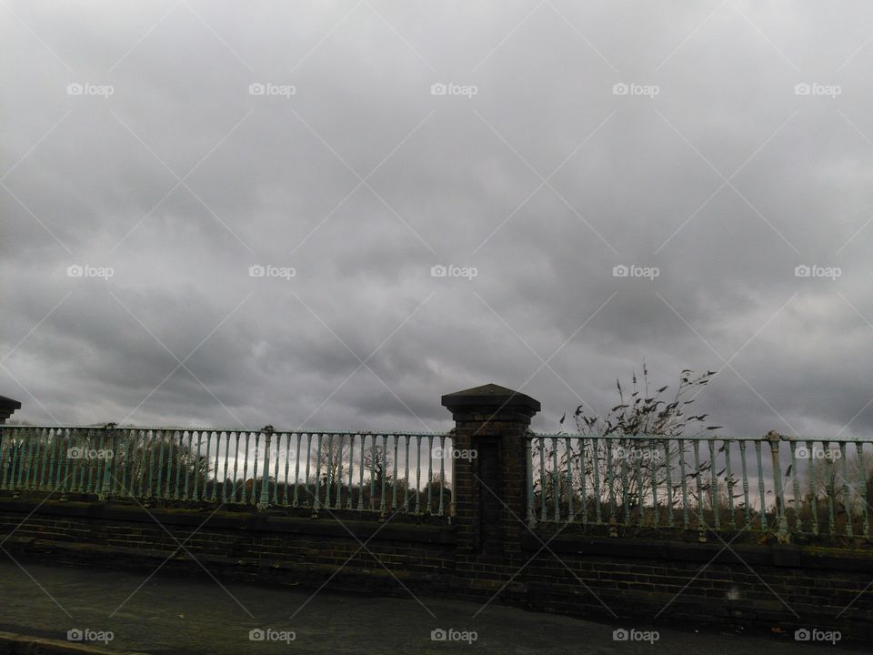railings and clouds