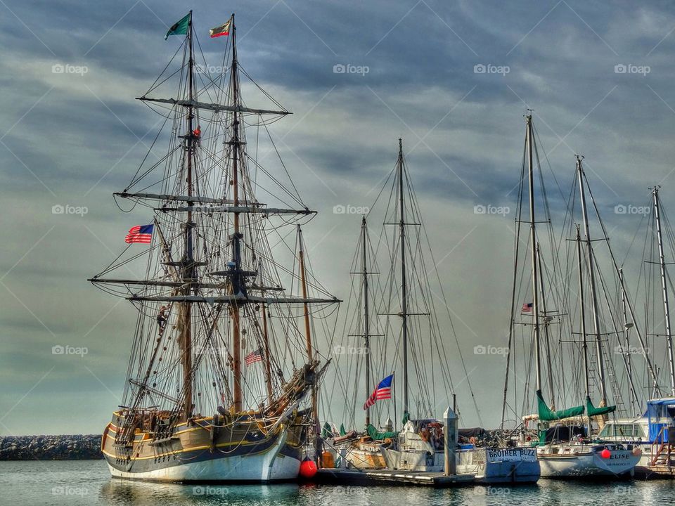 Antique sailing ship flying American flag