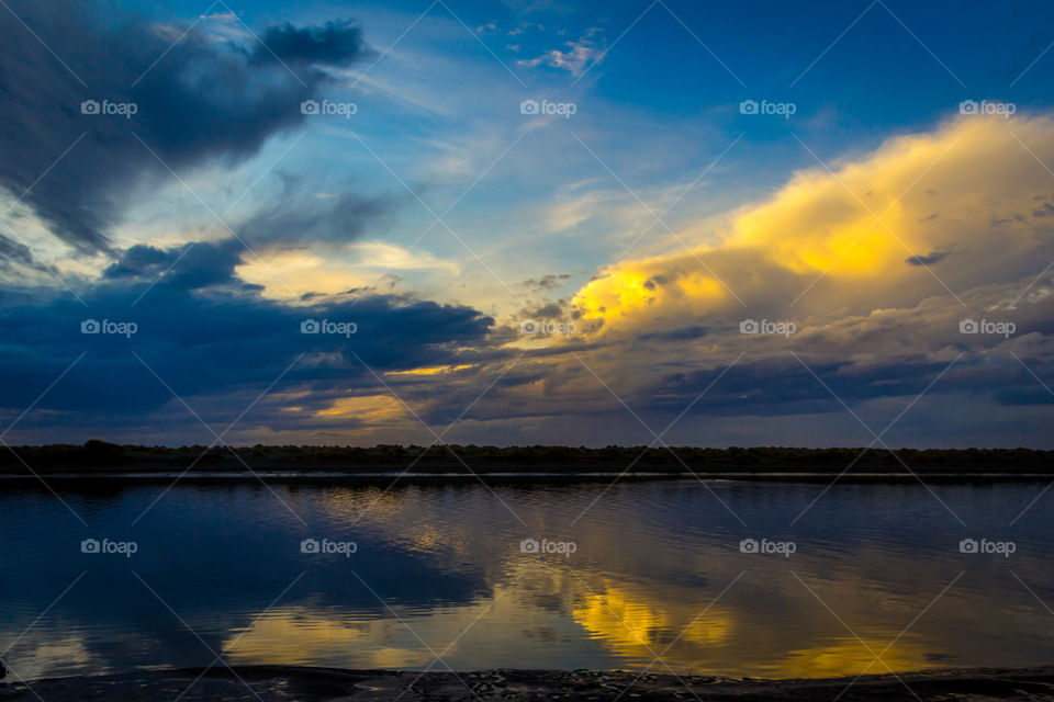 Clouds reflecting on lake st dusk