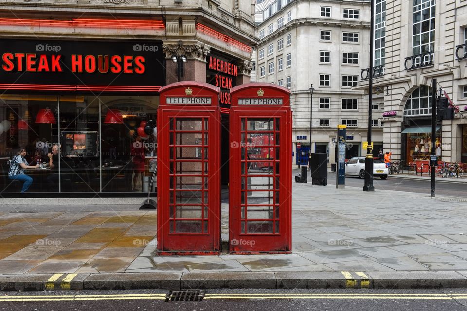 Red telephone booth in near Piccadilly Circus in London.