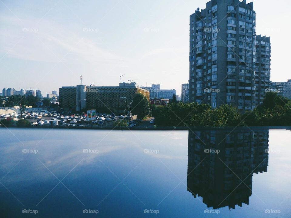 mirror reflection of a residential building on the off screen of a smartphone