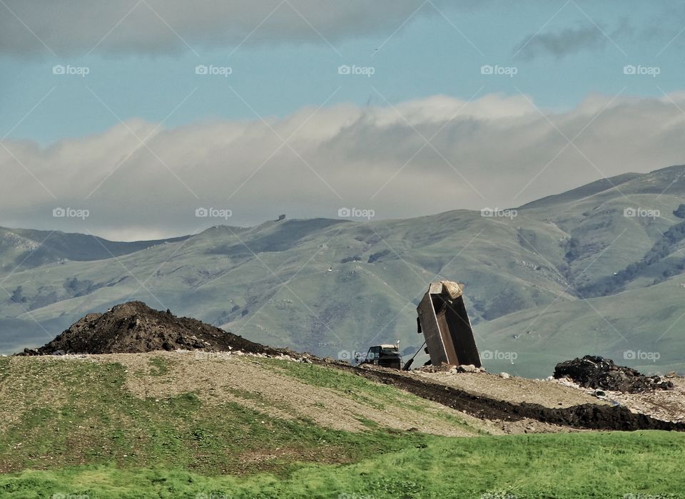 Dumping Trash At A Landfill