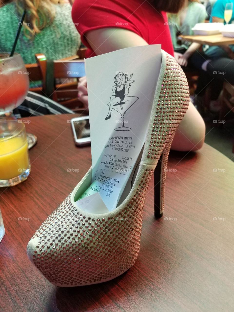 Crystal studded stiletto used to deliver your bill at a drag show, done with style and humor 