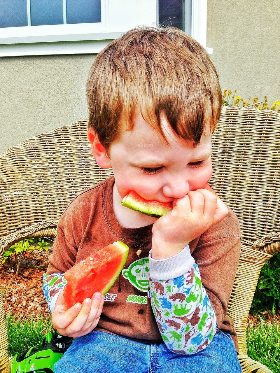 Eating Watermelon. Boy Eating Watermelon Slices In The Summer
