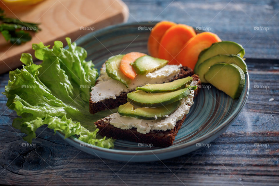 Dietary sandwiches with grain bread, cream cheese and avocado 