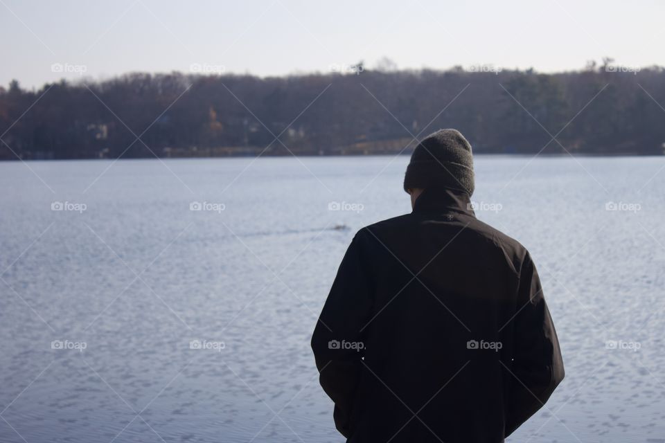 End of the trail; Man hiked to a Glacial Lake in Northeast Pennsylvania, Pike County USA