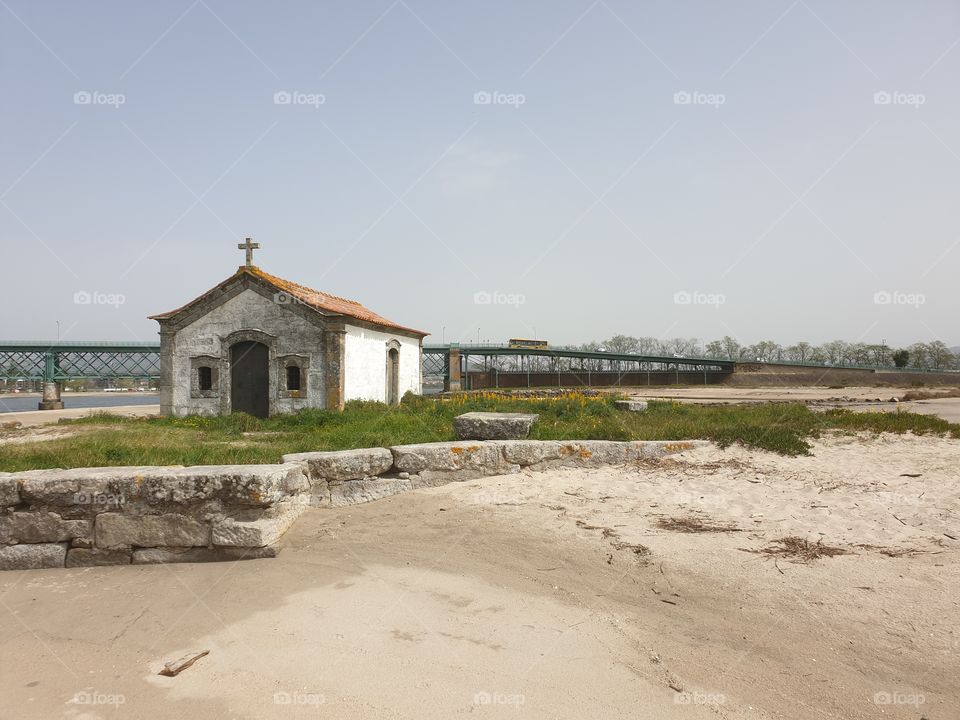 lonely Chapel near the river and the bridge