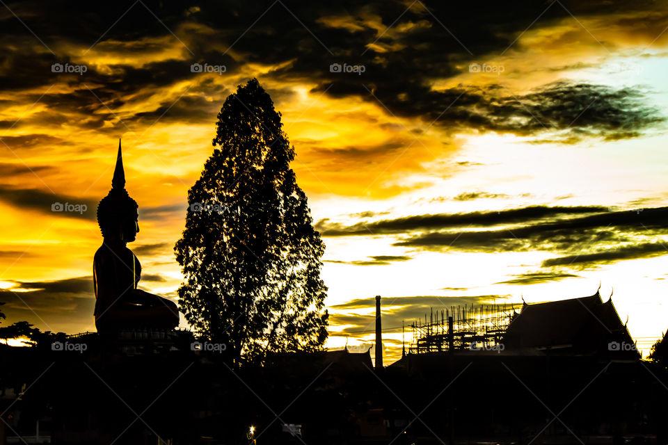 Sunset behind Wat Lad Pha Dook , Temple in Nonthaburi , Thailand.