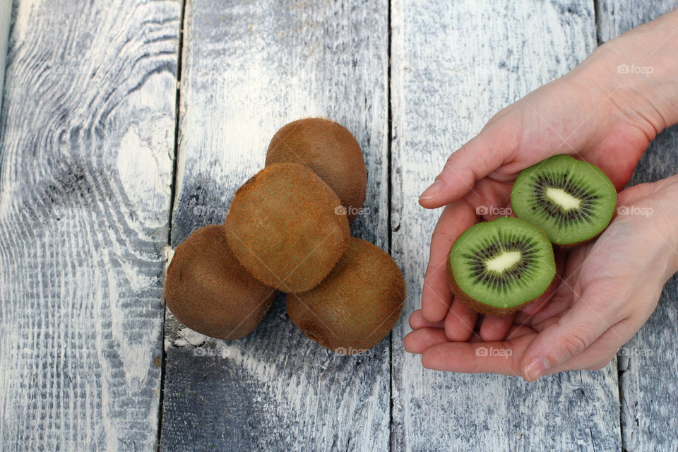 Hands, female hands, kiwi in hands, kiwi fruit, still life, abstraction