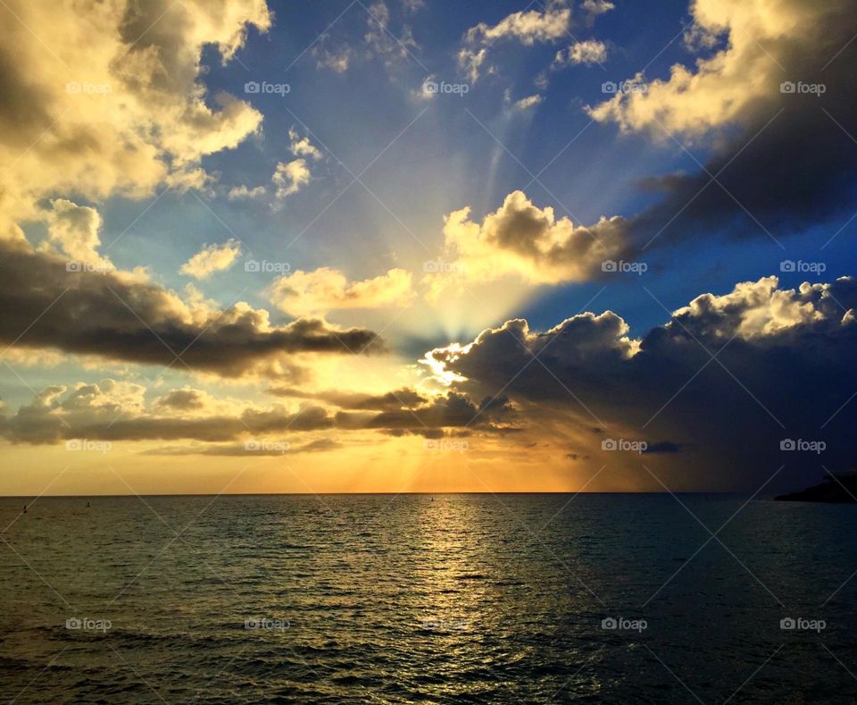 Sunrise in the Caribbean, sunrises behind the clouds, lighting up the sky, beautiful sky 