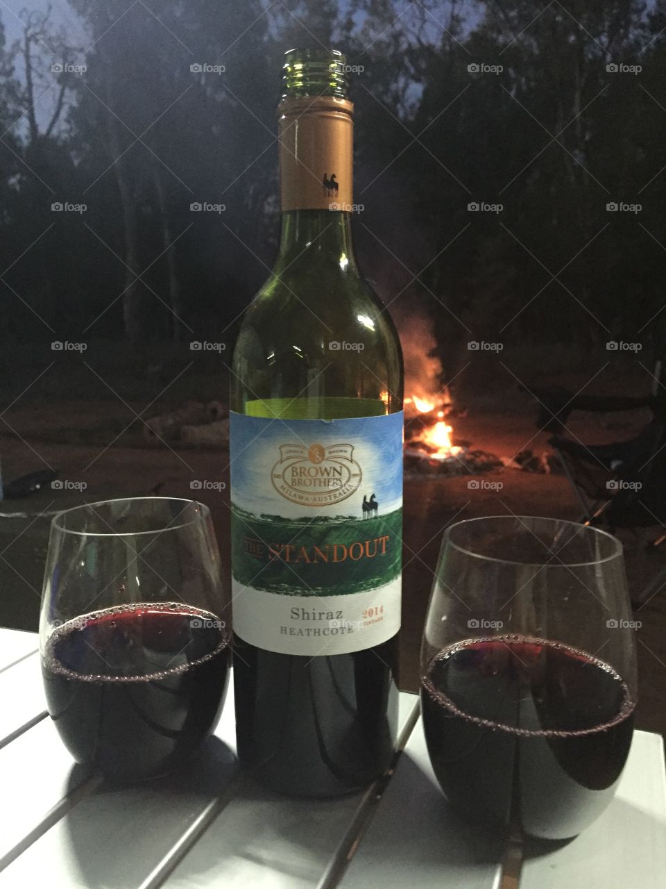 Wine while enjoying a camp fire 
