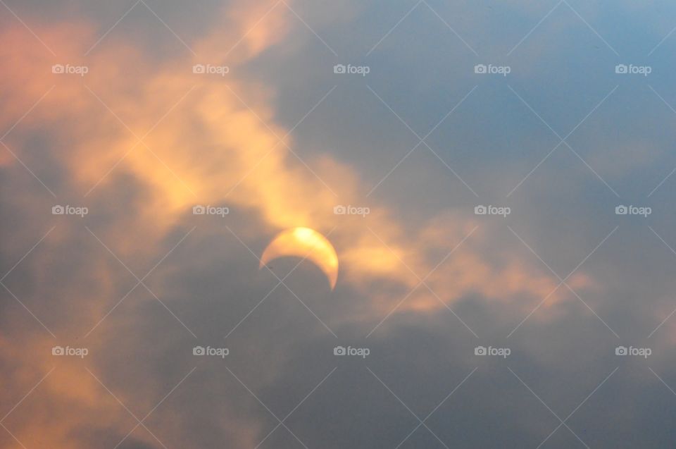 Cloudy summer eclipse
