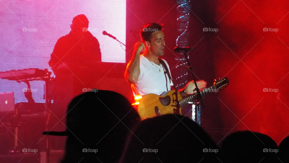 Guitarist performing on concert stage