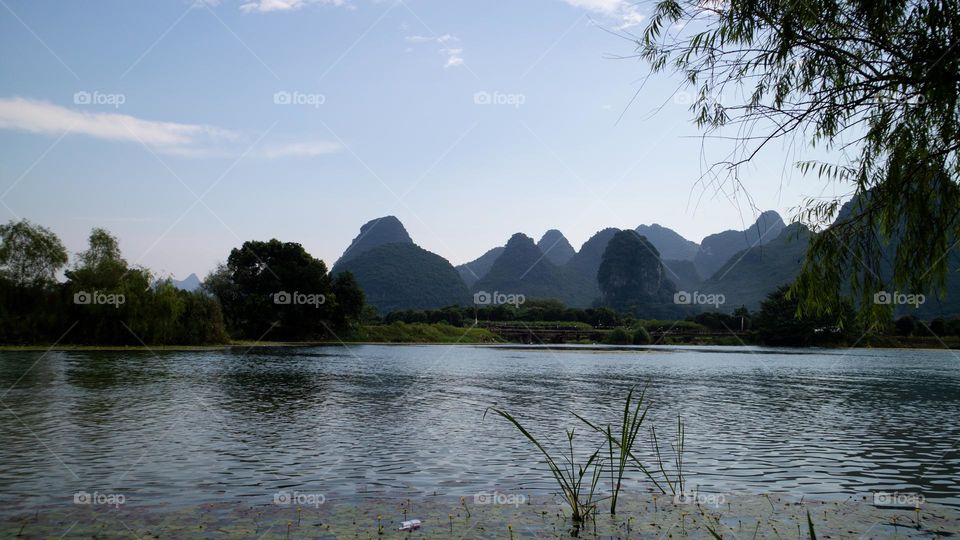 Keywords: mountain range, sunset, landscape, nature, scenic, beautiful, scenery, green, blue, sky, clouds, trees, mountains, hills, foreground, background, horizon, skyline, mountain range, sunset, landscape, nature, scenic, beautiful, scenery, green