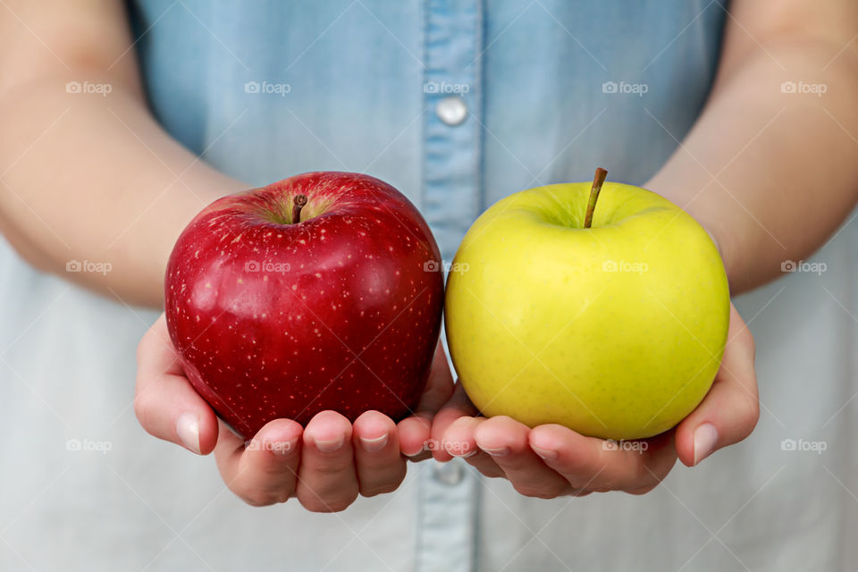 two apples in hands