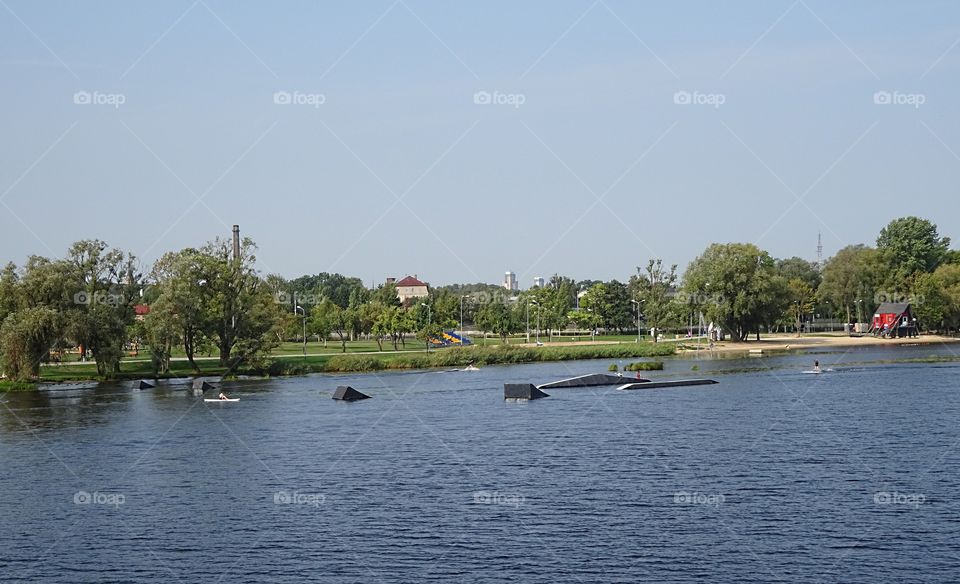 Wakeboard wakeboarding river water sports park for surfing springboard jump jumping on Daugava river in Riga city