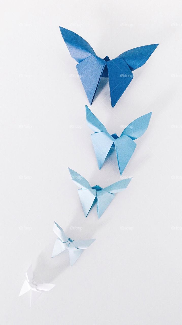 Origami butterflies in different shades of blue