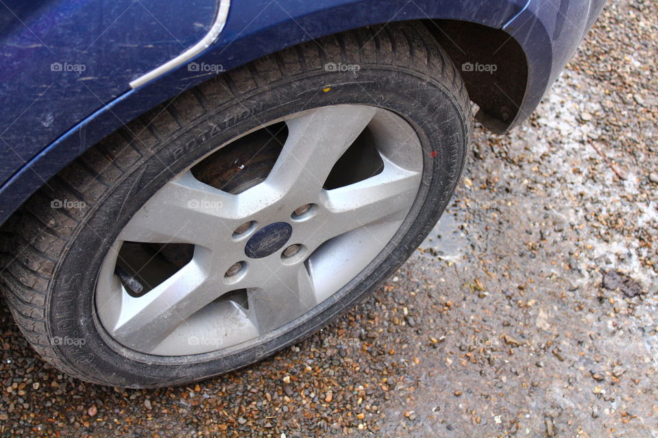 Blue Car wheel on gray background