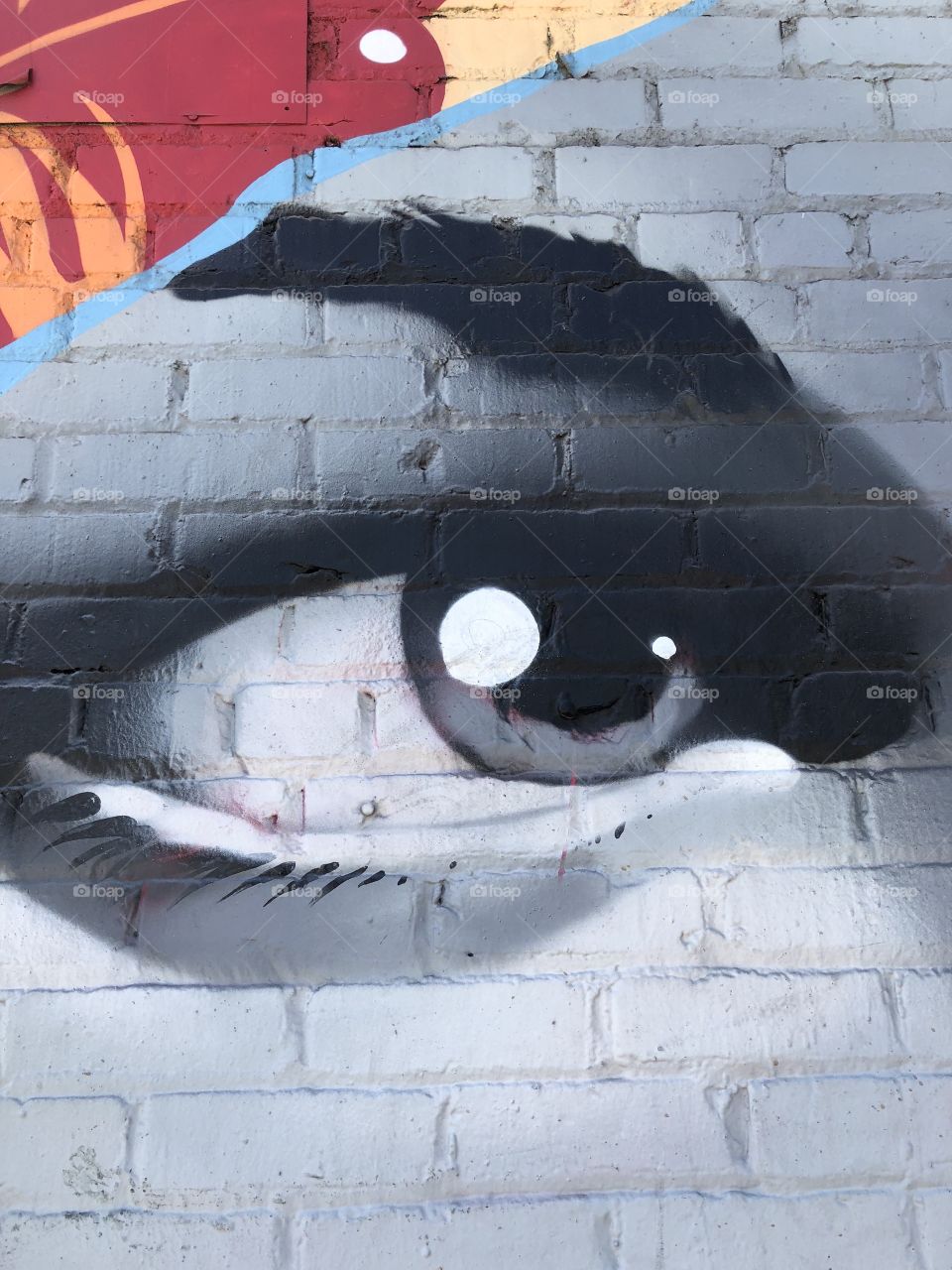 Art district. Painted brick.eye. Art. Wall