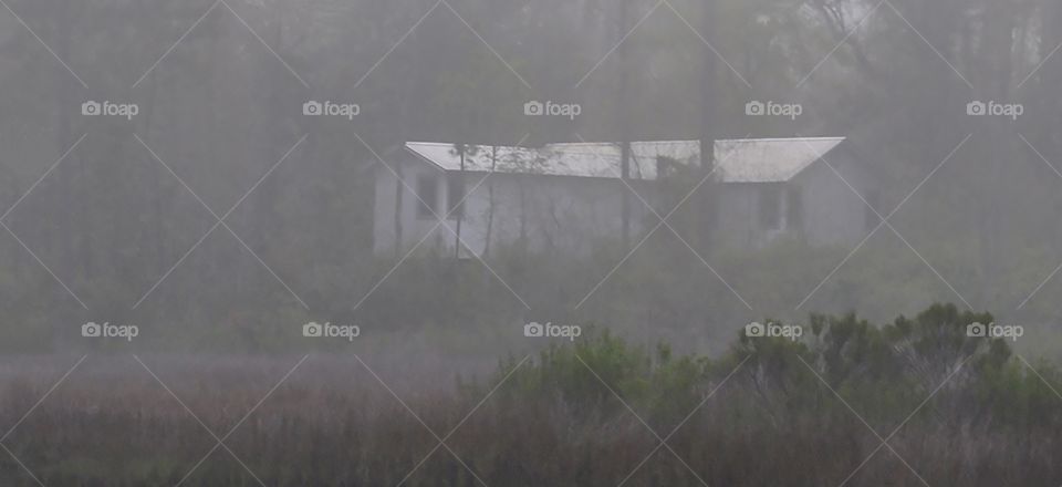 Old house in fog